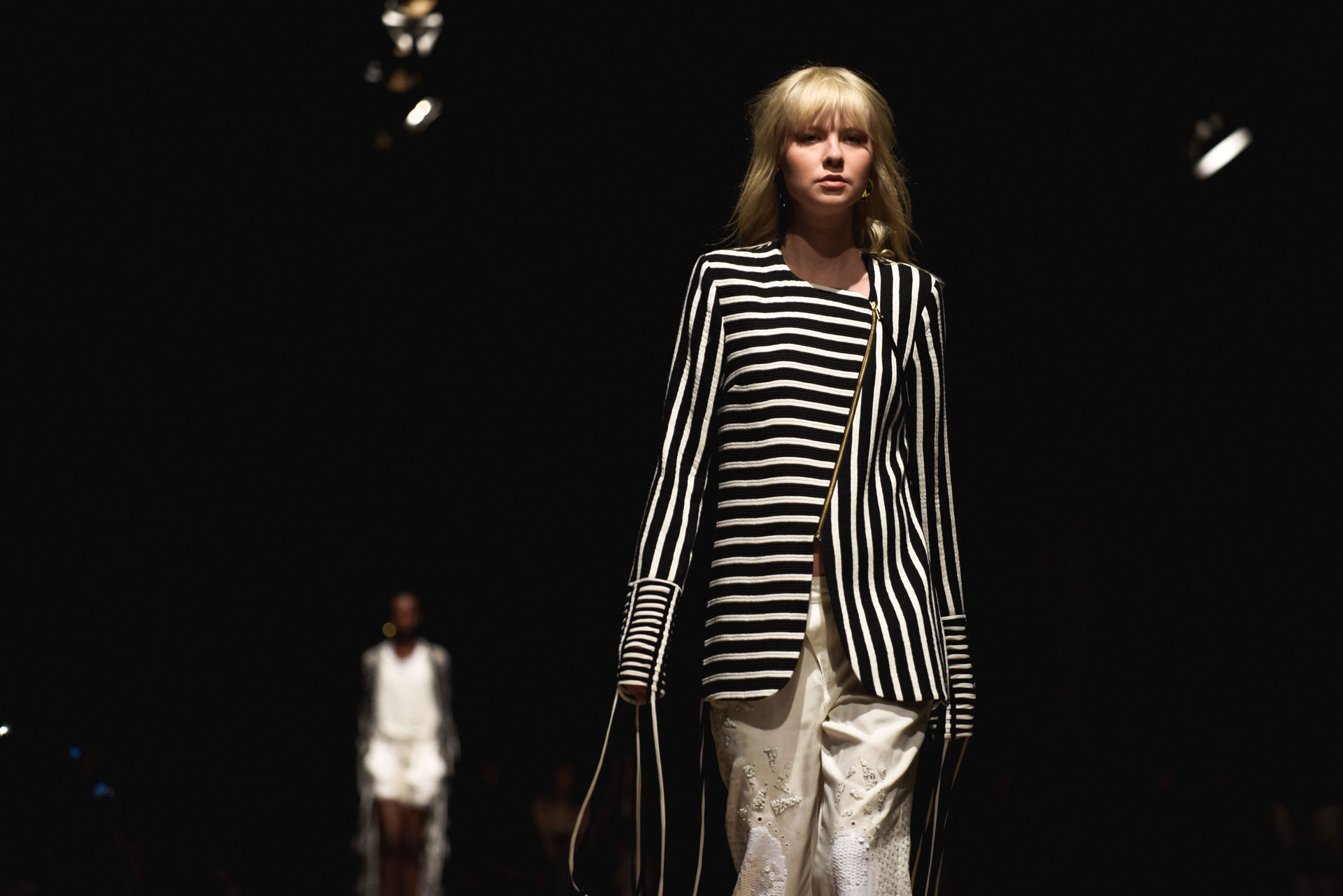 Woman walking a ramp during a fashion show